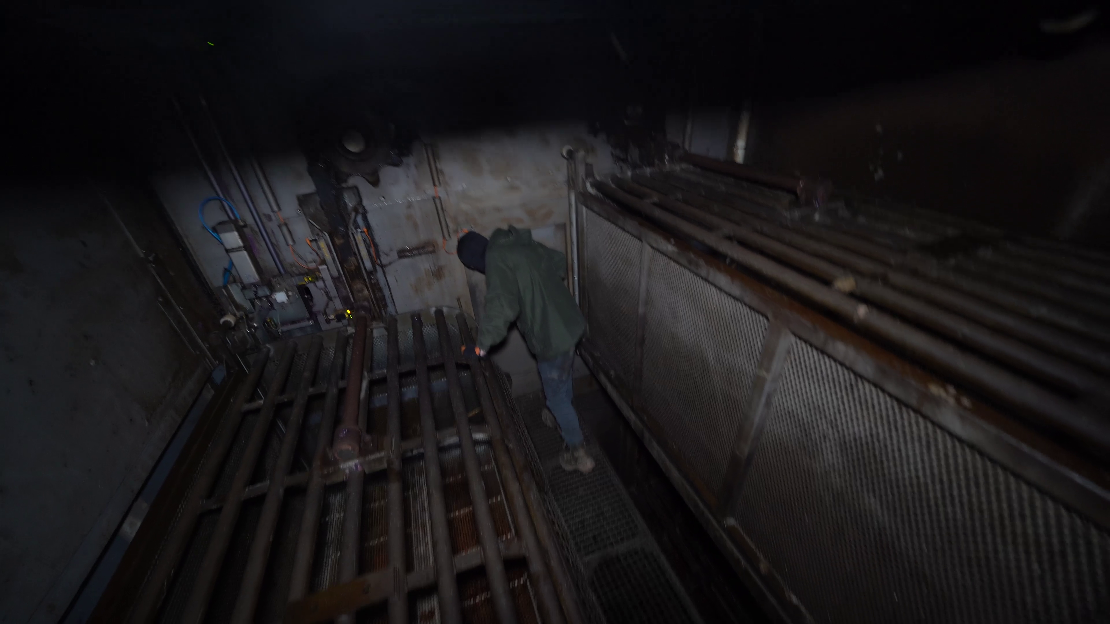 An investigator stands inside the backloader gas chamber