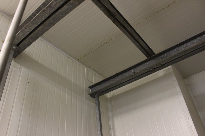 Ceiling beams in room containing gas chamber