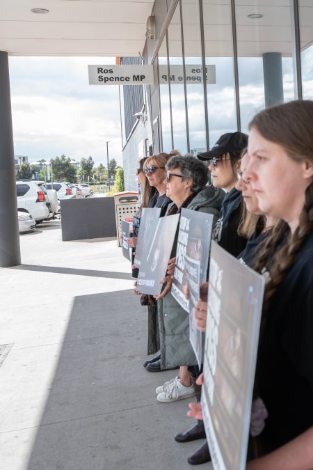 Protesters rallying outside Ros Spence MP's electorate office in Craigieburn