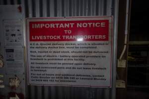 Signage at unloading area - Sign with notices to truck drivers regarding reporting animals transported and delivered - Captured at Benalla Abattoir, Benalla VIC Australia.