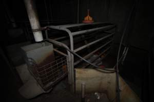 Empty farrowing crate in a state of disrepair - Captured at Evans Piggery, Sebastian VIC Australia.